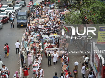 Medical students and doctors shout slogans during a protest rally towards Raj Bhavan, the official residence of the Governor of West Bengal...