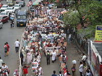 Medical students and doctors shout slogans during a protest rally towards Raj Bhavan, the official residence of the Governor of West Bengal...