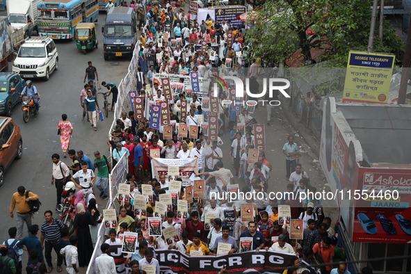 Medical students and doctors shout slogans during a protest rally towards Raj Bhavan, the official residence of the Governor of West Bengal...