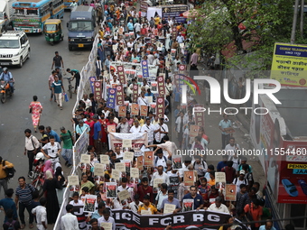 Medical students and doctors shout slogans during a protest rally towards Raj Bhavan, the official residence of the Governor of West Bengal...