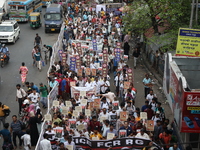 Medical students and doctors shout slogans during a protest rally towards Raj Bhavan, the official residence of the Governor of West Bengal...