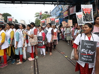 Medical students and doctors shout slogans during a protest rally towards Raj Bhavan, the official residence of the Governor of West Bengal...