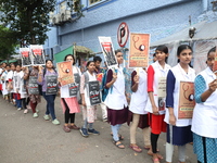 Medical students and doctors shout slogans during a protest rally towards Raj Bhavan, the official residence of the Governor of West Bengal...