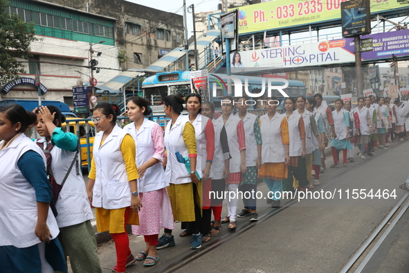 Medical students and doctors shout slogans during a protest rally towards Raj Bhavan, the official residence of the Governor of West Bengal...