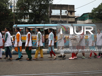 Medical students and doctors shout slogans during a protest rally towards Raj Bhavan, the official residence of the Governor of West Bengal...