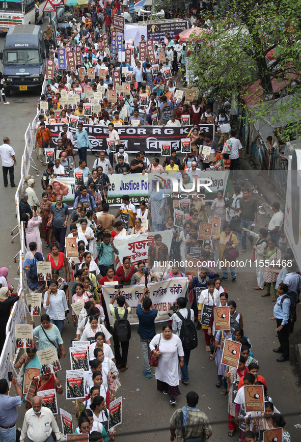 Medical students and doctors shout slogans during a protest rally towards Raj Bhavan, the official residence of the Governor of West Bengal...