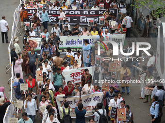 Medical students and doctors shout slogans during a protest rally towards Raj Bhavan, the official residence of the Governor of West Bengal...