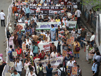 Medical students and doctors shout slogans during a protest rally towards Raj Bhavan, the official residence of the Governor of West Bengal...