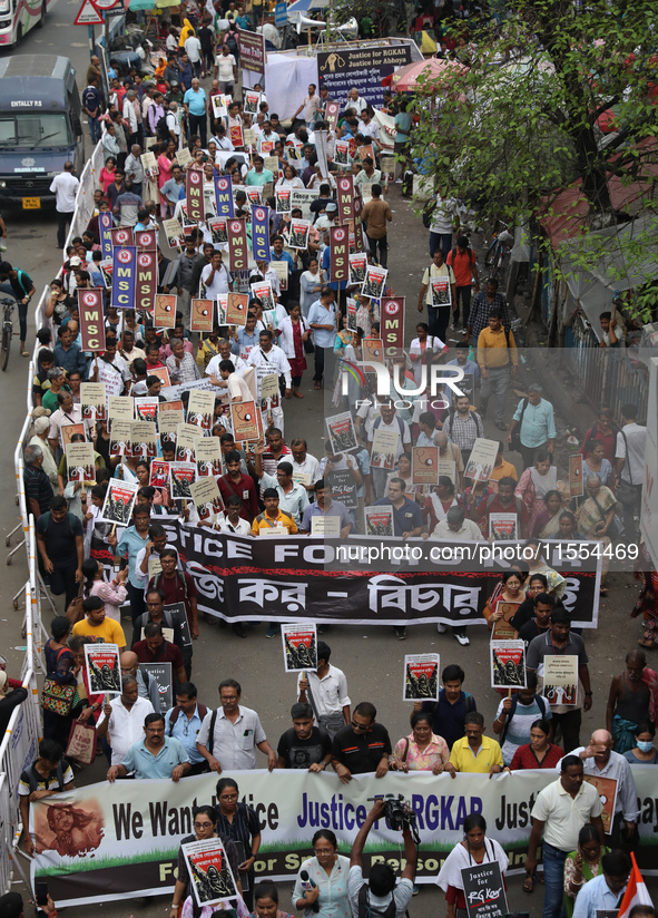 Medical students and doctors shout slogans during a protest rally towards Raj Bhavan, the official residence of the Governor of West Bengal...