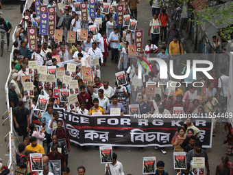 Medical students and doctors shout slogans during a protest rally towards Raj Bhavan, the official residence of the Governor of West Bengal...