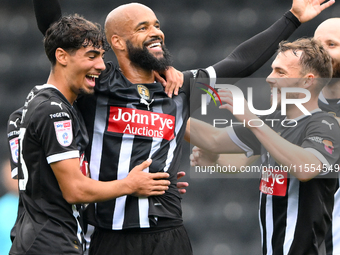 David McGoldrick of Notts County celebrates with teammates after scoring a goal to make it 1-0 during the Sky Bet League 2 match between Not...