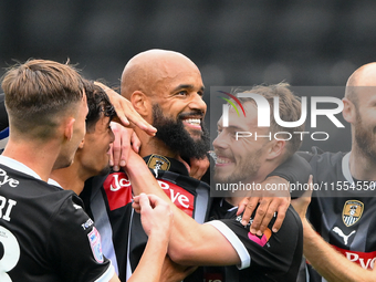 David McGoldrick of Notts County celebrates with teammates after scoring a goal to make it 1-0 during the Sky Bet League 2 match between Not...