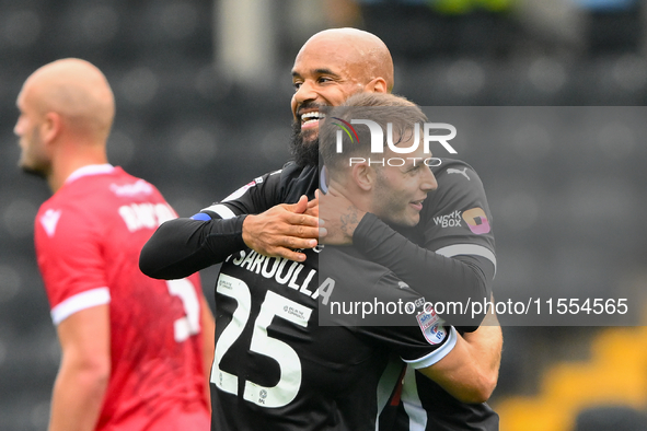 David McGoldrick of Notts County celebrates with Nicholas Tsaroulla of Notts County after scoring a goal to make it 1-0 during the Sky Bet L...