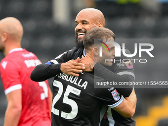 David McGoldrick of Notts County celebrates with Nicholas Tsaroulla of Notts County after scoring a goal to make it 1-0 during the Sky Bet L...