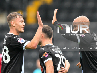 David McGoldrick of Notts County celebrates with a high-five with Lewis Macari of Notts County after scoring a goal to make it 1-0 during th...