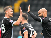 David McGoldrick of Notts County celebrates with a high-five with Lewis Macari of Notts County after scoring a goal to make it 1-0 during th...