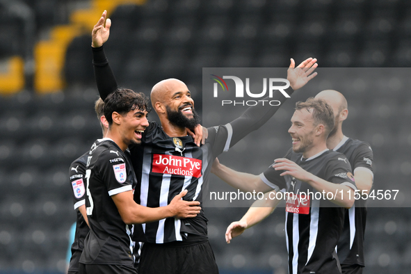 David McGoldrick of Notts County celebrates with teammates after scoring a goal to make it 1-0 during the Sky Bet League 2 match between Not...