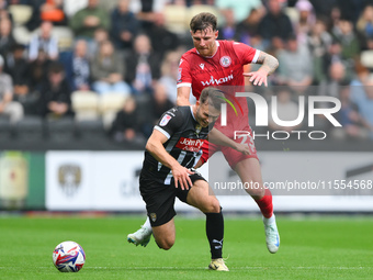 Tyler Walton of Accrington Stanley fouls Nicholas Tsaroulla of Notts County during the Sky Bet League 2 match between Notts County and Accri...