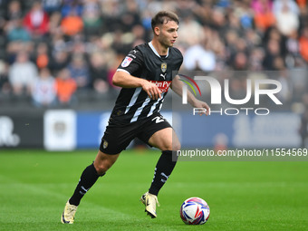 Nicholas Tsaroulla of Notts County runs with the ball during the Sky Bet League 2 match between Notts County and Accrington Stanley at Meado...