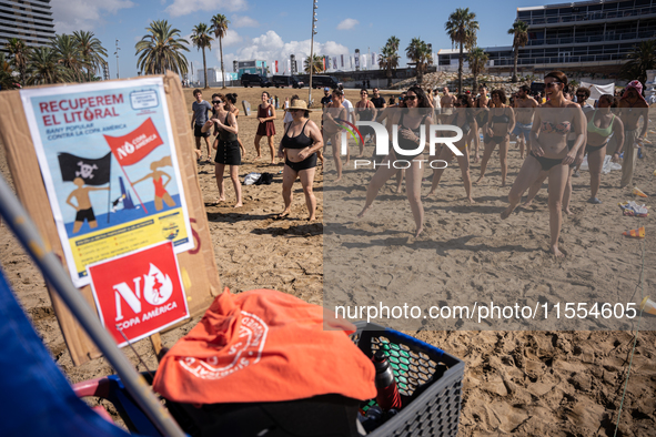 Dozens of Barcelona residents protest on the Somorrostro beach in the Barceloneta neighborhood against the America's Cup 2024, in Barcelona,...