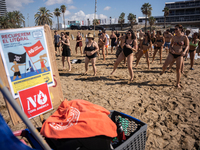 Dozens of Barcelona residents protest on the Somorrostro beach in the Barceloneta neighborhood against the America's Cup 2024, in Barcelona,...