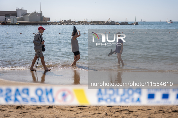 Dozens of Barcelona residents protest on the Somorrostro beach in the Barceloneta neighborhood against the America's Cup 2024, in Barcelona,...