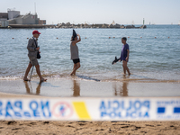 Dozens of Barcelona residents protest on the Somorrostro beach in the Barceloneta neighborhood against the America's Cup 2024, in Barcelona,...