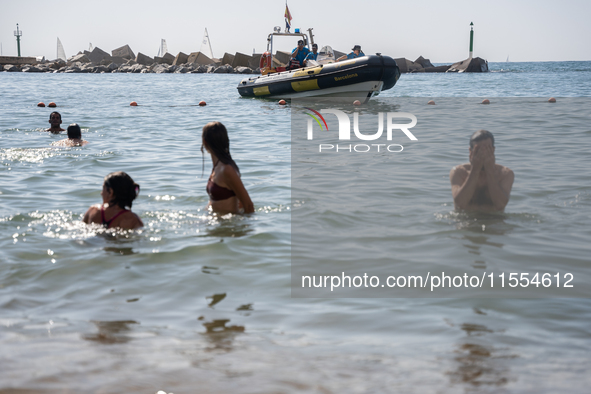 Dozens of Barcelona residents protest on the Somorrostro beach in the Barceloneta neighborhood against the America's Cup 2024, in Barcelona,...