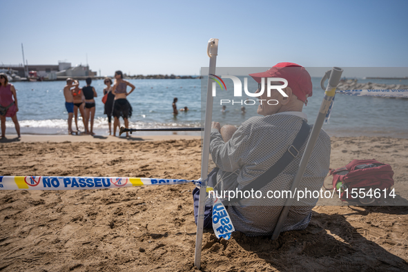 Dozens of Barcelona residents protest on the Somorrostro beach in the Barceloneta neighborhood against the America's Cup 2024, in Barcelona,...