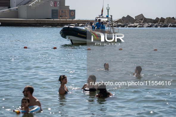 Dozens of Barcelona residents protest on the Somorrostro beach in the Barceloneta neighborhood against the America's Cup 2024, in Barcelona,...