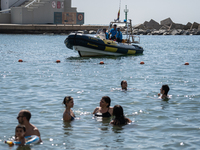 Dozens of Barcelona residents protest on the Somorrostro beach in the Barceloneta neighborhood against the America's Cup 2024, in Barcelona,...