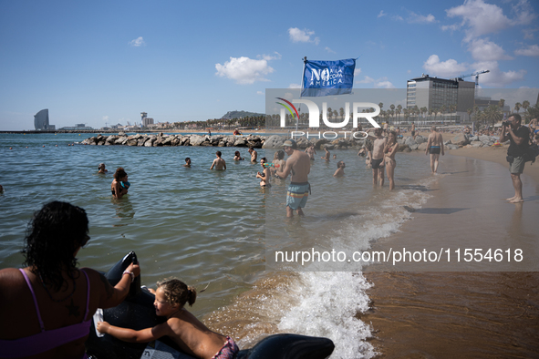 Dozens of Barcelona residents protest on the Somorrostro beach in the Barceloneta neighborhood against the America's Cup 2024, in Barcelona,...