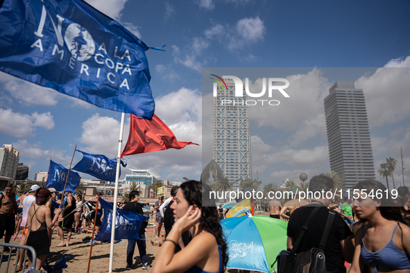 Dozens of Barcelona residents protest on the Somorrostro beach in the Barceloneta neighborhood against the America's Cup 2024, in Barcelona,...