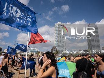 Dozens of Barcelona residents protest on the Somorrostro beach in the Barceloneta neighborhood against the America's Cup 2024, in Barcelona,...