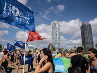 Dozens of Barcelona residents protest on the Somorrostro beach in the Barceloneta neighborhood against the America's Cup 2024, in Barcelona,...