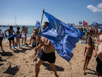 Dozens of Barcelona residents protest on the Somorrostro beach in the Barceloneta neighborhood against the America's Cup 2024, in Barcelona,...