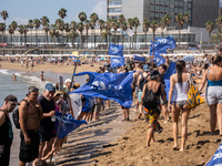 Dozens of Barcelona residents protest on the Somorrostro beach in the Barceloneta neighborhood against the America's Cup 2024, in Barcelona,...