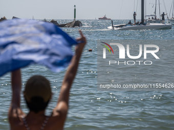 Dozens of Barcelona residents protest on the Somorrostro beach in the Barceloneta neighborhood against the America's Cup 2024, in Barcelona,...