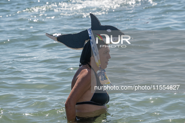 Dozens of Barcelona residents protest on the Somorrostro beach in the Barceloneta neighborhood against the America's Cup 2024, in Barcelona,...