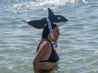 Dozens of Barcelona residents protest on the Somorrostro beach in the Barceloneta neighborhood against the America's Cup 2024, in Barcelona,...