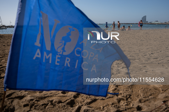 Dozens of Barcelona residents protest on the Somorrostro beach in the Barceloneta neighborhood against the America's Cup 2024, in Barcelona,...