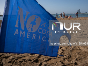 Dozens of Barcelona residents protest on the Somorrostro beach in the Barceloneta neighborhood against the America's Cup 2024, in Barcelona,...