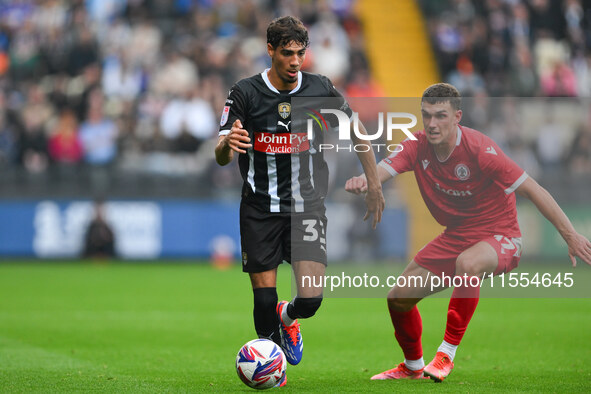 George Abbott of Notts County is under pressure from Dara Costelloe of Accrington Stanley during the Sky Bet League 2 match between Notts Co...