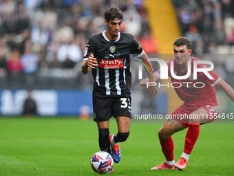 George Abbott of Notts County is under pressure from Dara Costelloe of Accrington Stanley during the Sky Bet League 2 match between Notts Co...