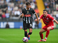 George Abbott of Notts County is under pressure from Dara Costelloe of Accrington Stanley during the Sky Bet League 2 match between Notts Co...