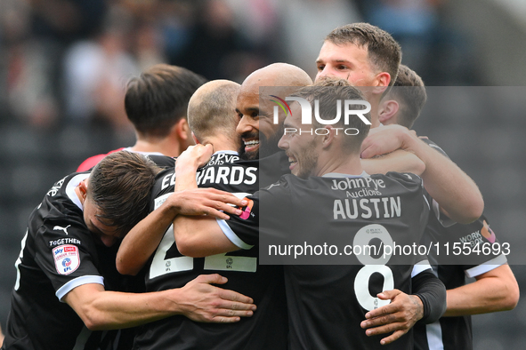 David McGoldrick of Notts County celebrates with teammates after scoring a goal to make it 2-0 during the Sky Bet League 2 match between Not...