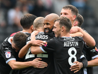 David McGoldrick of Notts County celebrates with teammates after scoring a goal to make it 2-0 during the Sky Bet League 2 match between Not...