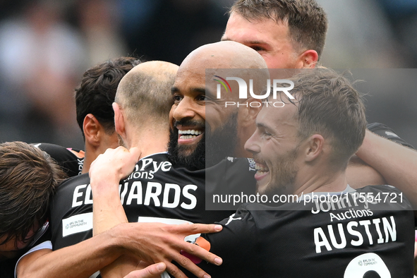 David McGoldrick of Notts County celebrates with teammates after scoring a goal to make it 2-0 during the Sky Bet League 2 match between Not...