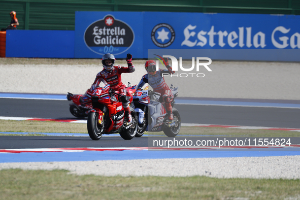 Ducati Spanish rider Jorge Martin rides ahead of Ducati Italian rider Francesco Bagnaia during the sprint race of the San Marino MotoGP Gran...