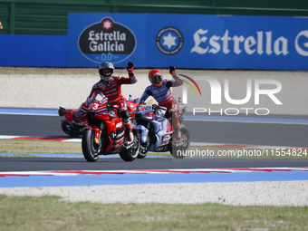 Ducati Spanish rider Jorge Martin rides ahead of Ducati Italian rider Francesco Bagnaia during the sprint race of the San Marino MotoGP Gran...